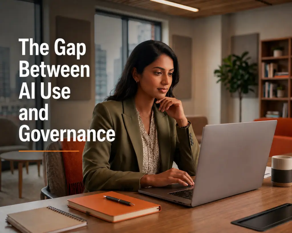 Does Your Nonprofit Have an AI Use Policy? Nearly Half Don’t. 3 A woman sits at a desk using a laptop. Various items including a notebook, pen, and coffee cup are also on the desk. She is in an office setting with large white text on the left that says, "The Gap Between AI Use and Governance."